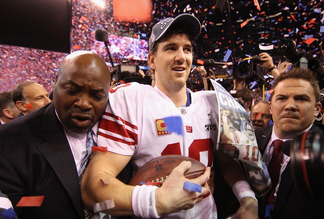 INDIANAPOLIS, IN - FEBRUARY 05:  Quarterback Eli Manning #10 of the New York Giants celebrates after defeating the New England Patriots 21-17 in Super Bowl XLVI at Lucas Oil Stadium on February 5, 2012 in Indianapolis, Indiana.  (Photo by Ezra Shaw/Getty Images)