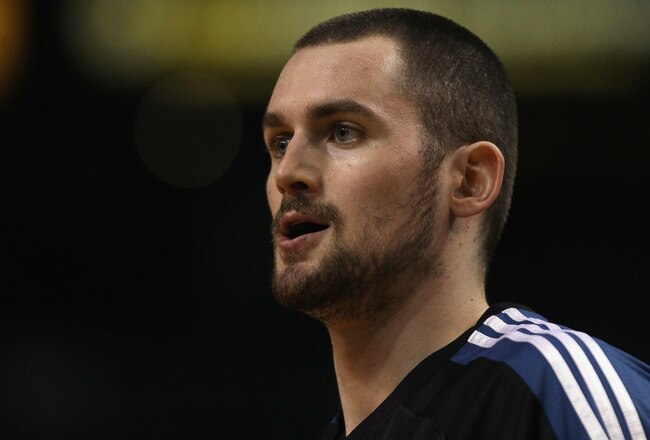 BOSTON, MA - JANUARY 03:  Kevin Love #42 of the Minnesota Timberwolves looks on before the game against the Boston Celtics on January 3, 2011 at the TD Garden in Boston, Massachusetts. NOTE TO USER: User expressly acknowledges and agrees that, by downloading and/or using this Photograph, User is consenting to the terms and conditions of the Getty Images License Agreement.  (Photo by Elsa/Getty Images)