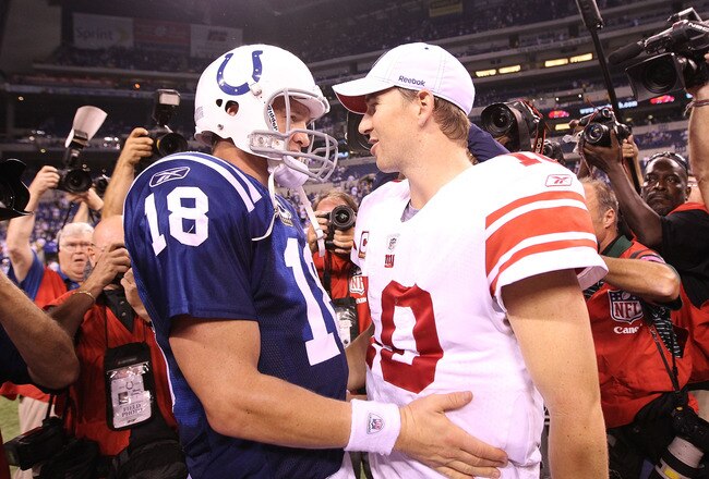 INDIANAPOLIS - SEPTEMBER 19:  Eli Manning #10 of the New York Giants and Peyton Manning #18 of the Indianapolis Colts embrace following the Colts 38-14 win at Lucas Oil Stadium on September 19, 2010 in Indianapolis, Indiana.  (Photo by Andy Lyons/Getty Images)
