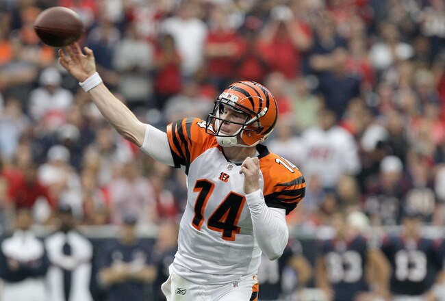 HOUSTON, TX - JANUARY 07:  Andy Dalton #14 of the Cincinnati Bengals throws a pass in the first half against the Houston Texans during their 2012 AFC Wild Card Playoff game at Reliant Stadium on January 7, 2012 in Houston, Texas.  (Photo by Thomas B. Shea/Getty Images)