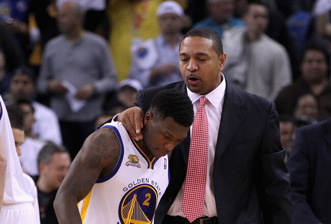 OAKLAND, CA - JANUARY 10:  Head coach Mark Jackson of the Golden State Warriors talks to Nate Robinson #2 of the Golden State Warriors during their game against the Miami Heat at Oracle Arena on January 10, 2012 in Oakland, California.  NOTE TO USER: User expressly acknowledges and agrees that, by downloading and or using this photograph, User is consenting to the terms and conditions of the Getty Images License Agreement.  (Photo by Ezra Shaw/Getty Images)