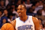 ORLANDO, FL - FEBRUARY 06:  Dwight Howard #12 of the Orlando Magic smiles during the game against the Los Angeles Clippers at Amway Center on February 6, 2012 in Orlando, Florida.   NOTE TO USER: User expressly acknowledges and agrees that, by downloading and or using this Photograph, user is consenting to the terms and conditions of the Getty Images License Agreement.  (Photo by Sam Greenwood/Getty Images)