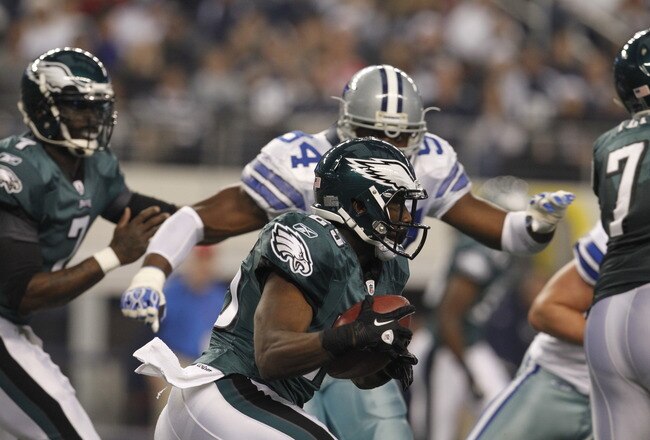ARLINGTON, TX - DECEMBER 24:  LeSean McCoy #25 of the Philadelphia Eagles carries the ball against  DeMarcus Ware #94 of the Dallas Cowboys at Cowboys Stadium on December 24, 2011 in Arlington, Texas.  (Photo by Tom Pennington/Getty Images)