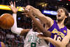BOSTON - JUNE 10:  Pau Gasol #16 of the Los Angeles Lakers disruptes a shot attempt by Rajon Rondo #9 of the Boston Celltics during Game Four of the 2010 NBA Finals on June 10, 2010 at TD Garden in Boston, Massachusetts. NOTE TO USER: User expressly acknowledges and agrees that, by downloading and/or using this Photograph, user is consenting to the terms and conditions of the Getty Images License Agreement.  (Photo by Ronald Martinez/Getty Images)