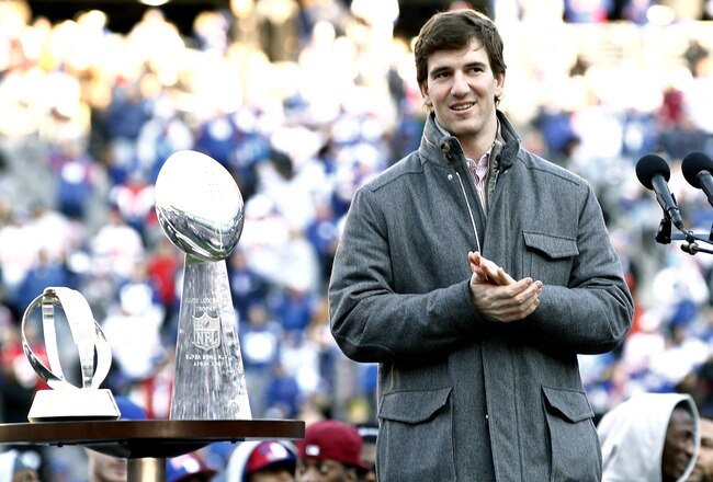 EAST RUTHERFORD, NJ - FEBRUARY 07:  Eli Manning #10 of the New York Giants speaks to fans at a rally to celebrate the New York Giants' Super Bowl victory at MetLife Stadium on February 7, 2012 in East Rutherford, New Jersey. The Giants defeated the New England Patriots 21-17 in Super Bowl XLVI at Lucas Oil Stadium on February 5, 2012 in Indianapolis, Indiana.  (Photo by Jeff Zelevansky/Getty Images)