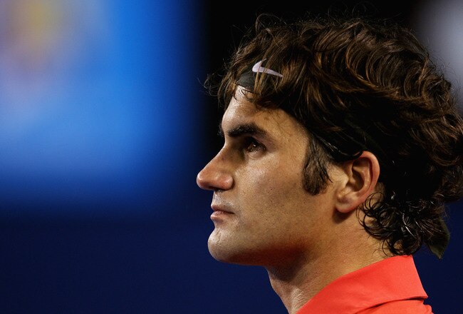 MELBOURNE, AUSTRALIA - JANUARY 26:  Roger Federer of Switzerland looks on in his semifinal match against Rafael Nadal of Spain during day eleven of the 2012 Australian Open at Melbourne Park on January 26, 2012 in Melbourne, Australia.  (Photo by Lucas Dawson/Getty Images)