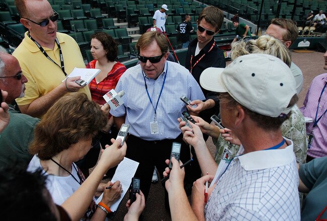 CHICAGO - JUNE 25: General manager Jim Hendry of the Chicago Cubs (center) talks to reporters before a game against the Chicago White Sox at U.S. Cellular Field on June 25, 2010 in Chicago, Illinois. (Photo by Jonathan Daniel/Getty Images)
