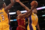 LOS ANGELES, CA - JANUARY 13:  Ramon Sessions #3 of the Cleveland Cavaliers goes up for a shot between Darius Morris #1 and Devin Ebanks #3 of the Los Angeles Lakers at Staples Center on January 13, 2012 in Los Angeles, California.  The Lakers won 97-92.  NOTE TO USER: User expressly acknowledges and agrees that, by downloading and or using this photograph, User is consenting to the terms and conditions of the Getty Images License Agreement.  (Photo by Stephen Dunn/Getty Images)