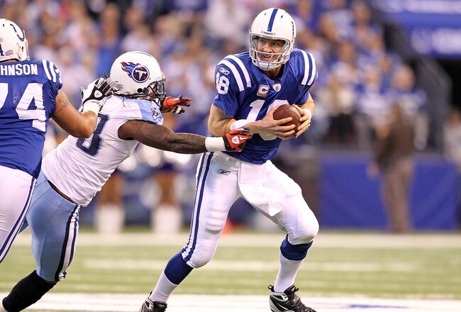 INDIANAPOLIS - JANUARY 02:  Peyton Manning #18 of the Indianapolis Colts looks to pass the ball while defended by Jacob Ford #78 of the Tennessee Titans during the NFL game at Lucas Oil Stadium on January 2, 2011 in Indianapolis, Indiana.  (Photo by Andy Lyons/Getty Images)
