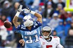 NASHVILLE, TN - NOVEMBER 27:   Quarterback Josh Freeman #5 of the Tampa Bay Buccaneers throws a pass around Cortland Finnegan #31 of the Tennessee Titans at LP Field on November 27, 2011 in Nashville, Tennessee.  (Photo by Wesley Hitt/Getty Images)