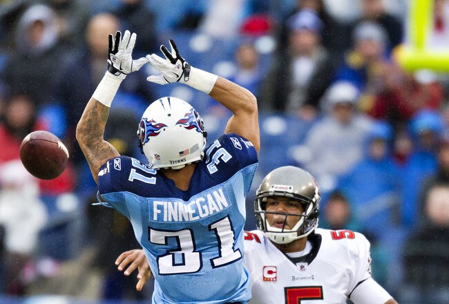 NASHVILLE, TN - NOVEMBER 27:   Quarterback Josh Freeman #5 of the Tampa Bay Buccaneers throws a pass around Cortland Finnegan #31 of the Tennessee Titans at LP Field on November 27, 2011 in Nashville, Tennessee.  (Photo by Wesley Hitt/Getty Images)