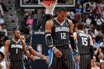 ATLANTA, GA - APRIL 24:  Dwight Howard #12 of the Orlando Magic walks downcourt after a turnover to the Atlanta Hawks during Game Four of the Eastern Conference Quarterfinals in the 2011 NBA Playoffs at Philips Arena on April 24, 2011 in Atlanta, Georgia.  NOTE TO USER: User expressly acknowledges and agrees that, by downloading and or using this photograph, User is consenting to the terms and conditions of the Getty Images License Agreement.  (Photo by Kevin C. Cox/Getty Images)