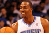 ORLANDO, FL - FEBRUARY 06:  Dwight Howard #12 of the Orlando Magic smiles during the game against the Los Angeles Clippers at Amway Center on February 6, 2012 in Orlando, Florida.   NOTE TO USER: User expressly acknowledges and agrees that, by downloading and or using this Photograph, user is consenting to the terms and conditions of the Getty Images License Agreement.  (Photo by Sam Greenwood/Getty Images)