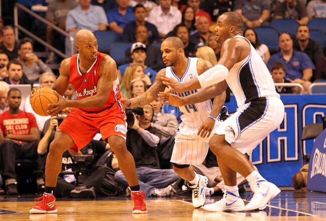 ORLANDO, FL - FEBRUARY 06:  Chauncey Billups #1 of the Los Angeles Clippers is guarded by Glen Davis #11 and Jameer Nelson #14 of the Orlando Magic during the game at Amway Center on February 6, 2012 in Orlando, Florida.   NOTE TO USER: User expressly acknowledges and agrees that, by downloading and or using this Photograph, user is consenting to the terms and conditions of the Getty Images License Agreement.  (Photo by Sam Greenwood/Getty Images)