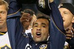 CARSON, CA - NOVEMBER 20:  Juninho #19 of the Los Angeles Galaxy hoists over his head the Philip F. Anschutz Trophy after the Los Angeles Galaxy defeated the Houston Dynamo 1-0 in the 2011 MLS Cup at The Home Depot Center on November 20, 2011 in Carson, California.  (Photo by Victor Decolongon/Getty Images)