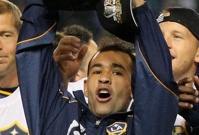 CARSON, CA - NOVEMBER 20:  Juninho #19 of the Los Angeles Galaxy hoists over his head the Philip F. Anschutz Trophy after the Los Angeles Galaxy defeated the Houston Dynamo 1-0 in the 2011 MLS Cup at The Home Depot Center on November 20, 2011 in Carson, California.  (Photo by Victor Decolongon/Getty Images)