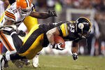 CLEVELAND, OH - JANUARY 01:  Running back Isaac Redman #33 of the Pittsburgh Steelers is hit by linebacker D'Qwell Jackson #52 of the Cleveland Browns at Cleveland Browns Stadium on January 1, 2012 in Cleveland, Ohio.  (Photo by Matt Sullivan/Getty Images)