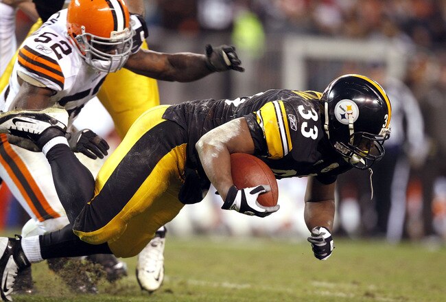 CLEVELAND, OH - JANUARY 01:  Running back Isaac Redman #33 of the Pittsburgh Steelers is hit by linebacker D'Qwell Jackson #52 of the Cleveland Browns at Cleveland Browns Stadium on January 1, 2012 in Cleveland, Ohio.  (Photo by Matt Sullivan/Getty Images)