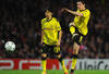 LONDON, ENGLAND - NOVEMBER 23:  Shinji Kagawa of Dortmund looks on as  Robert Lewandowski of Dortmund takes a shot during the UEFA Champions League Group F match between Arsenal FC and Borussia Dortmund  at Emirates Stadium on November 23, 2011 in London, England.  (Photo by Mike Hewitt/Getty Images)