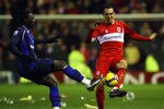 MIDDLESBROUGH, UNITED KINGDOM - JANUARY 10:  Kenwyne Jones of Sunderland tackles Emanuel Pogatetz of Middlesbrough during the Barclays Premier League match between Middlesbrough and Sunderland at the Riverside Stadium on January 10, 2009 in Middlesbrough, England.  (Photo by Alex Livesey/Getty Images)