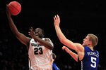 NEW YORK - NOVEMBER 15: Draymond Green #23 of the Michigan State Spartens drives to the basket against Mason Plumlee #5 of the Duke Blue Devils 5quare Garden on November 15, 2011 in New York City.  (Photo by Chris Trotman/Getty Images)