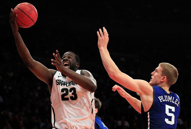 NEW YORK - NOVEMBER 15: Draymond Green #23 of the Michigan State Spartens drives to the basket against Mason Plumlee #5 of the Duke Blue Devils 5quare Garden on November 15, 2011 in New York City.  (Photo by Chris Trotman/Getty Images)