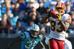 CHARLOTTE, NC - OCTOBER 23: Fred Davis #83 of the Washington Redskins makes a catch against Charles Godfrey #30 of the Carolina Panthers at the Bank of America Stadium on October 23, 2011 in Charlotte, North Carolina.  (Photo by Dilip Vishwanat/Getty Images)
