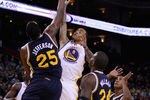 OAKLAND, CA - JANUARY 07:  Monta Ellis #8 of the Golden State Warriors shoots over Al Jefferson #25 of the Utah Jazz at Oracle Arena on January 7, 2012 in Oakland, California.  NOTE TO USER: User expressly acknowledges and agrees that, by downloading and or using this photograph, User is consenting to the terms and conditions of the Getty Images License Agreement.  (Photo by Ezra Shaw/Getty Images)