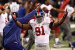 INDIANAPOLIS, IN - FEBRUARY 05:  Justin Tuck #91 of the New York Giants celebrates after defeating the New England Patriots 21-17 during Super Bowl XLVI at Lucas Oil Stadium on February 5, 2012 in Indianapolis, Indiana.  (Photo by Win McNamee/Getty Images)