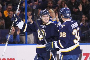 ST. LOUIS, MO - JANUARY 7: Kevin Shattenkirk #22 of the St. Louis Blues celebrates his goal with teammate Matt D'Agostini #36 against the Colorado Avalanche at the Scottrade Center on January 7, 2012 in St. Louis, Missouri.  (Photo by Dilip Vishwanat/Getty Images)