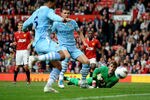 MANCHESTER, ENGLAND - OCTOBER 23:  Edin Dzeko of Manchester City scores his team's fourth goal during the Barclays Premier League match between Manchester United and Manchester City at Old Trafford on October 23, 2011 in Manchester, England.  (Photo by Laurence Griffiths/Getty Images)
