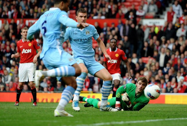 MANCHESTER, ENGLAND - OCTOBER 23:  Edin Dzeko of Manchester City scores his team's fourth goal during the Barclays Premier League match between Manchester United and Manchester City at Old Trafford on October 23, 2011 in Manchester, England.  (Photo by Laurence Griffiths/Getty Images)