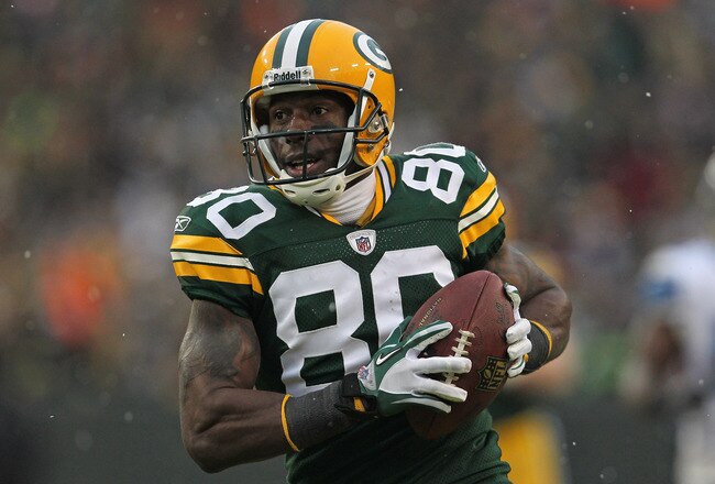 GREEN BAY, WI - JANUARY 01:  Donald Driver #80 of the Green Bay Packers reacts as he scores a touchdown against the Detroit Lions at Lambeau Field on January 1, 2012 in Green Bay, Wisconsin. The Packers defeated the Lions 45-41.  (Photo by Jonathan Daniel/Getty Images)