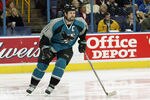 ST. LOUIS - FEBRUARY 8:  Owen Nolan #11 of the San Jose Sharks skates on the ice during the game against the St. Louis Blues on February 8, 2003 at the Savvis Center in St. Louis, Missouri. The Blues defeated the Sharks 4-1.  (Photo by Elsa/Getty Images/NHLI)