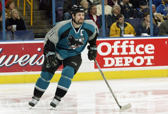 ST. LOUIS - FEBRUARY 8:  Owen Nolan #11 of the San Jose Sharks skates on the ice during the game against the St. Louis Blues on February 8, 2003 at the Savvis Center in St. Louis, Missouri. The Blues defeated the Sharks 4-1.  (Photo by Elsa/Getty Images/NHLI)
