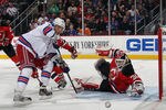 NEWARK, NJ - DECEMBER 20: Artem Anisimov #42 of the New York Rangers is stopped by Martin Brodeur #30 of the New Jersey Devils in the first period at the Prudential Center on December 20, 2011 in Newark, New Jersey.  (Photo by Bruce Bennett/Getty Images)