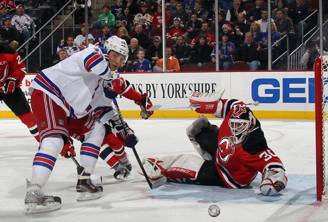 NEWARK, NJ - DECEMBER 20: Artem Anisimov #42 of the New York Rangers is stopped by Martin Brodeur #30 of the New Jersey Devils in the first period at the Prudential Center on December 20, 2011 in Newark, New Jersey.  (Photo by Bruce Bennett/Getty Images)