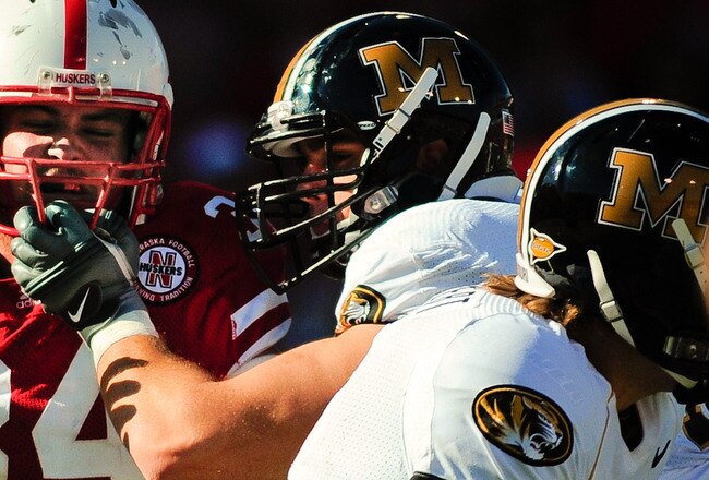 LINCOLN, NE - OCTOBER 30: Defensive end Cameron Meredith #34 of the Nebraska Cornhuskers  tries to beat offensive linesman Elvis Fisher #72 of the Missouri Tigers during first half action of their game at Memorial Stadium on October 30, 2010 in Lincoln, Nebraska. Nebraska Defeated Missouri 31-17. (Photo by Eric Francis/Getty Images)