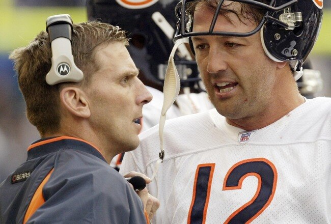 SEATTLE - OCTOBER 19:  Quarterback Chris Chandler #12 of the Chicago Bears talks with Offensive Coordinator John Shoop on October19, 2003 at Seahawks Stadium in Seattle, Washington. The Bears lost to the Seattle Seahawks 24-17.  (Photo by Otto Greule Jr/Getty Images)