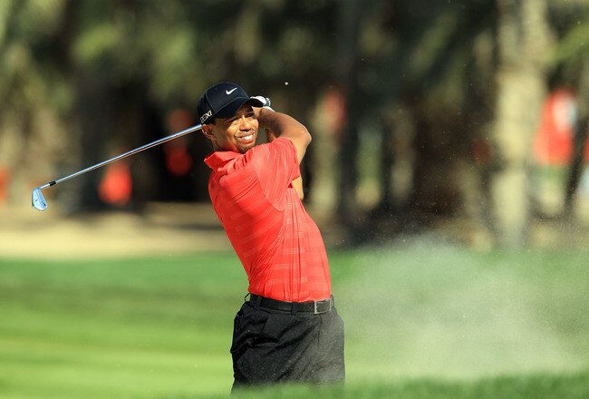 ABU DHABI, UNITED ARAB EMIRATES - JANUARY 29:  Tiger Woods of the USA plays his second shot on the par 5, 10th hole during the final round of the Abu Dhabi HSBC Championship at the Abu Dhabi Golf Club on January 29, 2012 in Abu Dhabi, United Arab Emirates.  (Photo by David Cannon/Getty Images)