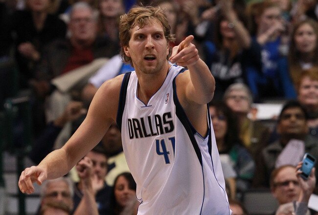 DALLAS, TX - JANUARY 04:  Dirk Nowitzki #41 of the Dallas Mavericks reacts after scoring against the Phoenix Suns at American Airlines Center on January 4, 2012 in Dallas, Texas. Nowitzki was playing in his 1,000 career game.  NOTE TO USER: User expressly acknowledges and agrees that, by downloading and/or using this Photograph, user is consenting to the terms and conditions of the Getty Images License Agreement.  (Photo by Ronald Martinez/Getty Images)
