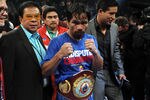 LAS VEGAS, NV - NOVEMBER 12:  Manny Pacquiao celebrates his majority decision victory against Juan Manuel Marquez in the WBO world welterweight title fight at the MGM Grand Garden Arena on November 12, 2011 in Las Vegas, Nevada.  (Photo by Harry How/Getty Images)
