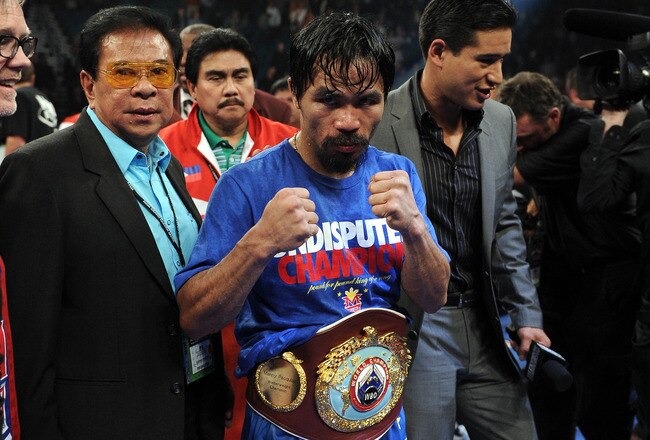 LAS VEGAS, NV - NOVEMBER 12:  Manny Pacquiao celebrates his majority decision victory against Juan Manuel Marquez in the WBO world welterweight title fight at the MGM Grand Garden Arena on November 12, 2011 in Las Vegas, Nevada.  (Photo by Harry How/Getty Images)