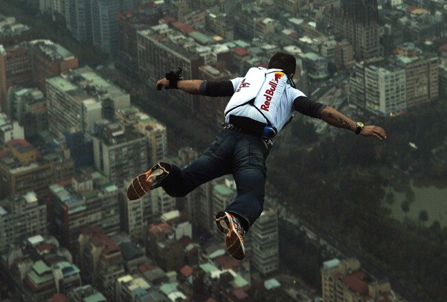 TAIPEI, TAIWAN - DECEMBER 12: (EDITORIAL USE ONLY - NO SALES, NO ARCHIVING) In this handout provided by Euro-Newsroom, a 38-year-old Felix Baumgartner, Austrian base jumper, makes a jump off the world's tallest completed building, the 508-meter high Taipei 101 Tower, December 12, 2007 in Taipei,Taiwan.   (Photo by Joerg Mitter/Euro-Newsroom via Getty Images)