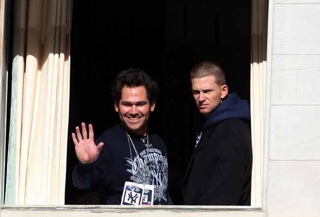 NEW YORK - NOVEMBER 06:  Johnny Damon #18 and A.J. Burnett #34 of the New York Yankees wave to the crowd during the New York Yankees World Series Victory Celebration at City Hall on November 6, 2009 in New York, New York.  (Photo by Jim McIsaac/Getty Images)
