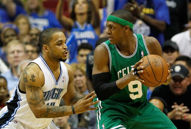 ORLANDO, FL - MAY 26:  Rajon Rondo #9 of the Boston Celtics looks to pass against Jameer Nelson #14 of the Orlando Magic in Game Five of the Eastern Conference Finals during the 2010 NBA Playoffs at Amway Arena on May 26, 2010 in Orlando, Florida.  NOTE TO USER: User expressly acknowledges and agrees that, by downloading and/or using this Photograph, user is consenting to the terms and conditions of the Getty Images License Agreement.  (Photo by Kevin C. Cox/Getty Images)