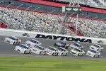 DAYTONA BEACH, FL - JANUARY 14:  Carl Edwards, driver of the #99 Fastenal Ford, and A.J. Allmendinger, driver of the #22 Shell/Pennzoil Dodge, lead a pack of cars through the tri-oval during Daytona Preseason Thunder at Daytona International Speedway on January 14, 2012 in Daytona Beach, Florida.  (Photo by Jared C. Tilton/Getty Images for NASCAR)