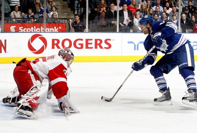 TORONTO, CANADA - JANUARY 7: Phil Kessel #81 of the Toronto Maple Leafs scores on Jimmy Howard #35 of the Detroit Red Wings during a penalty shot during NHL action at The Air Canada Centre January 7, 2012 in Toronto, Ontario, Canada. (Photo by Abelimages/Getty Images)