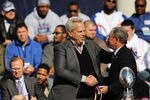 NEW YORK, NY - FEBRUARY 07: New York Giants co-owner Steve Tisch (L) greets New York Mayor Michael Bloomberg as the team is honored at City Hall Plaza following a ticker-tape parade in Manhattan for the second time in four years after winning the Super Bowl against the New England Patriots on February 7, 2012 in New York City. The Giants beat the Patriots 21-17 at Lucas Oil Stadium in Indianapolis on February 5. The New York parade started at Battery Place and continued through the financial district, an area known as the 'Canyon of Heroes,' to be followed by a rally at their home MetLife Stadium in East Rutherford, New Jersey.  (Photo by Spencer Platt/Getty Images)