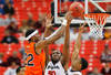 ATLANTA, GA - MARCH 10:  Kenny Gabriel #22 of the Auburn Tigers shoots over Gerald Robinson #22 and Jeremy Price #50 of the Georgia Bulldogs during the the first round of the SEC Men's Basketball Tournament at the Georgia Dome on March 10, 2011 in Atlanta, Georgia.  (Photo by Kevin C. Cox/Getty Images)